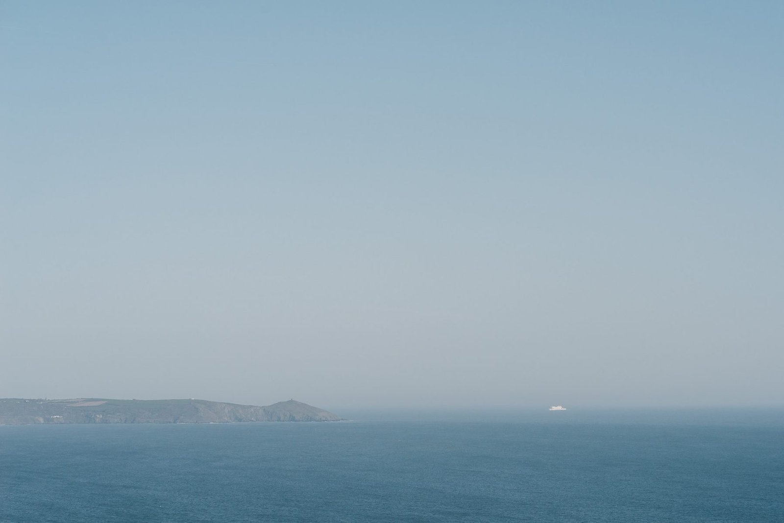 Calm sea and a distant headland. Photograph by Ivo Dukić.