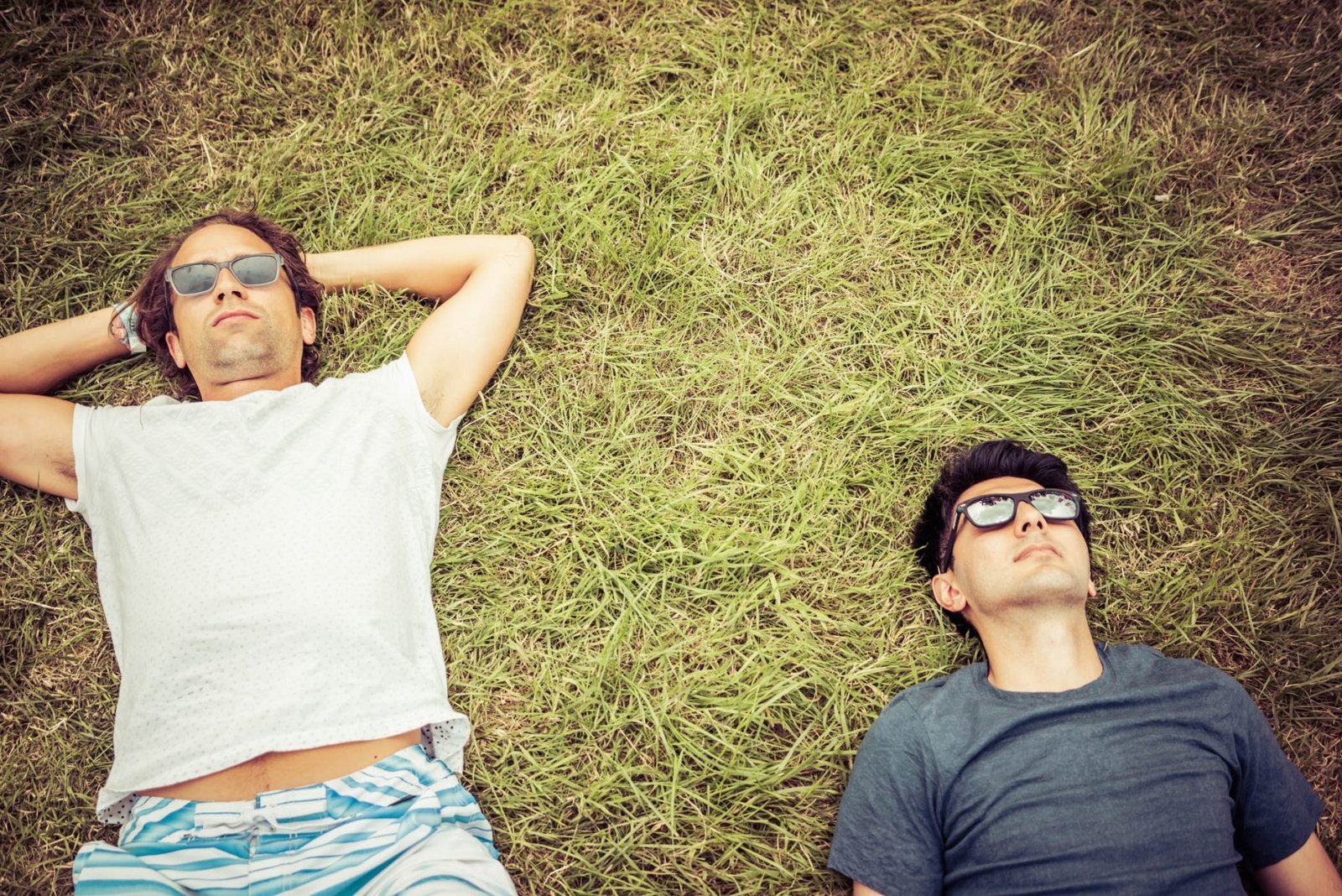 Relaxing before the festival starts, under the Glastonbury letters. Worthy Farm, England. Photograph by Ivo Dukić.